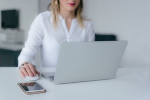 person posting on social media on computer