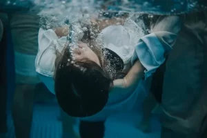 woman submerged in baptism